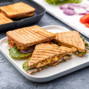 vegetable sandwiches are being made with cottage cheese, onions, tomato and lettuce